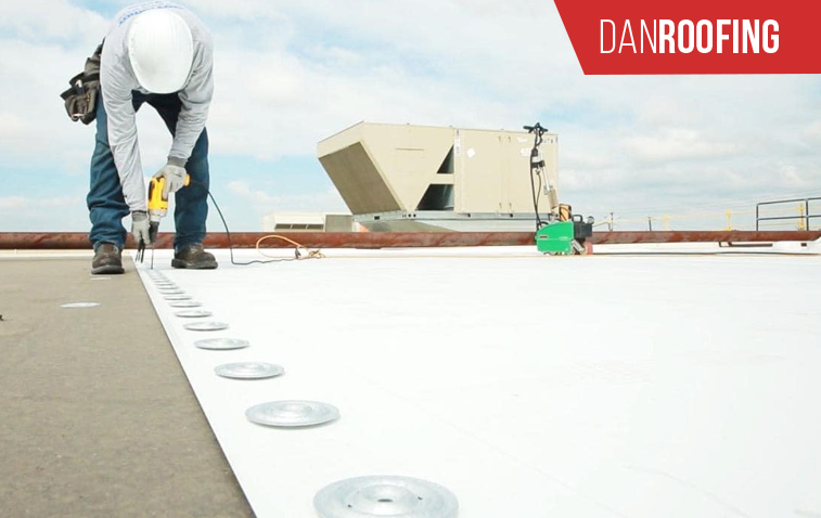 Firestone TPO roofing installed on a commercial building, showcasing weather resistance and durability.