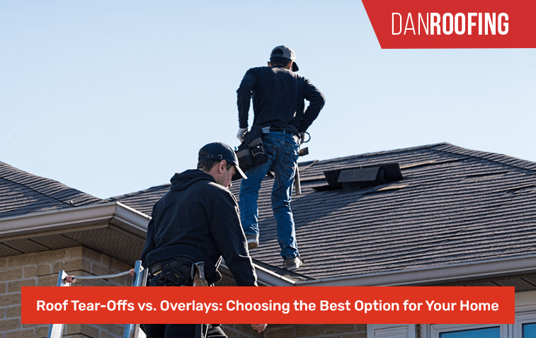 Workers performing a roof tear-off on a residential home.